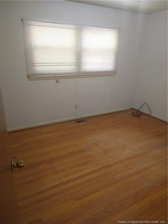 1829 Martindale Dr, Fayetteville, NC 28304 - empty room featuring wood finished floors and baseboards