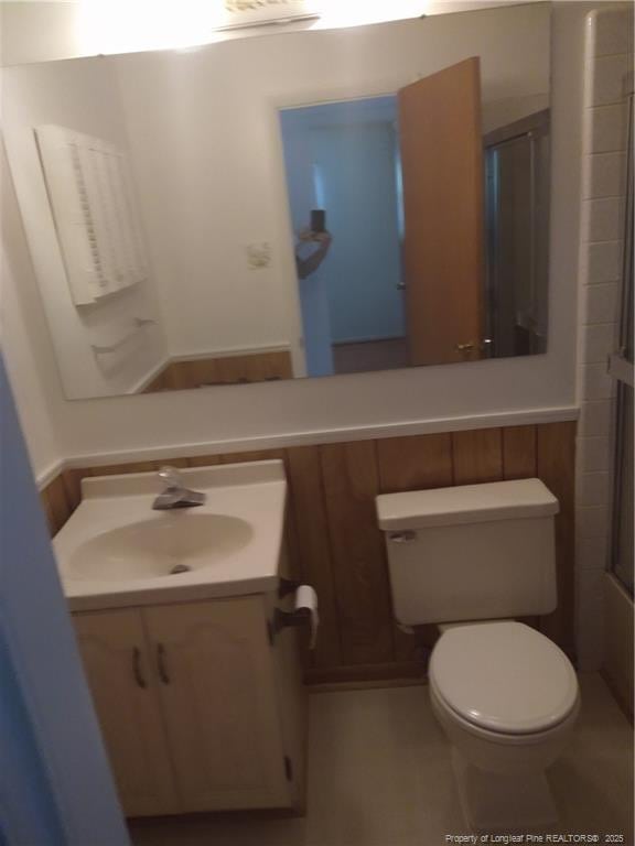 1829 Martindale Dr, Fayetteville, NC 28304 - bathroom featuring vanity, toilet, and an enclosed shower