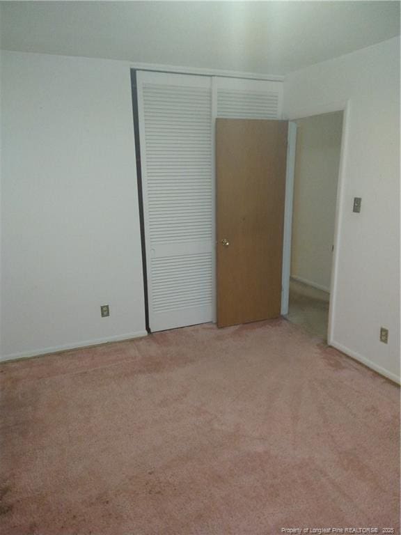 1829 Martindale Dr, Fayetteville, NC 28304 - unfurnished bedroom featuring light carpet, a closet, and baseboards
