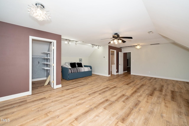 7805 Tuscan Ridge Dr, Wendell, NC 27591 - additional living space with light wood finished floors, a ceiling fan, lofted ceiling, and baseboards