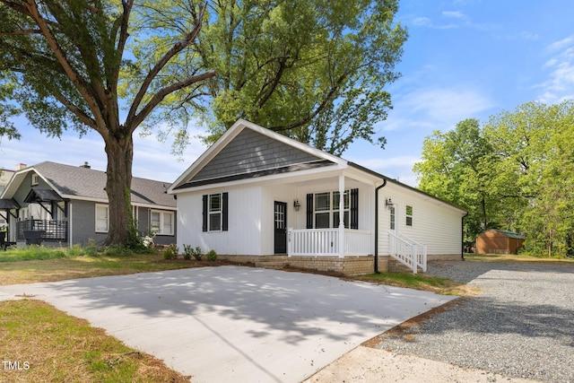 208 W Holt St, Burlington, NC 27217 - view of front of house with a porch, an outdoor structure, and a storage unit
