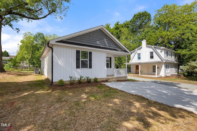 208 W Holt St, Burlington, NC 27217 - view of front of house with a porch and a chimney