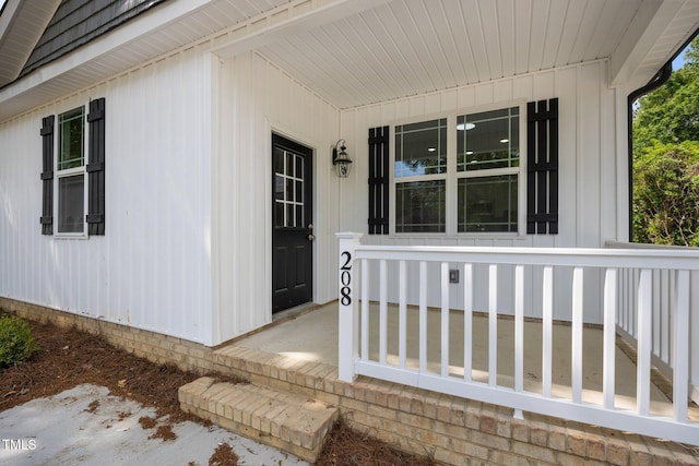 208 W Holt St, Burlington, NC 27217 - doorway to property featuring covered porch
