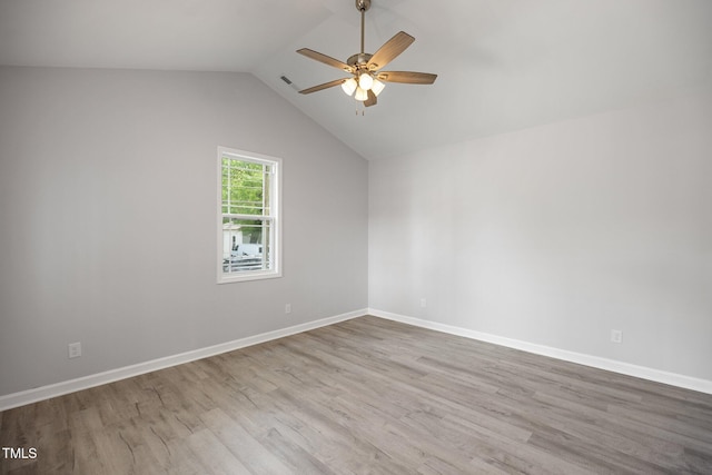 208 W Holt St, Burlington, NC 27217 - empty room featuring ceiling fan, wood finished floors, baseboards, and vaulted ceiling