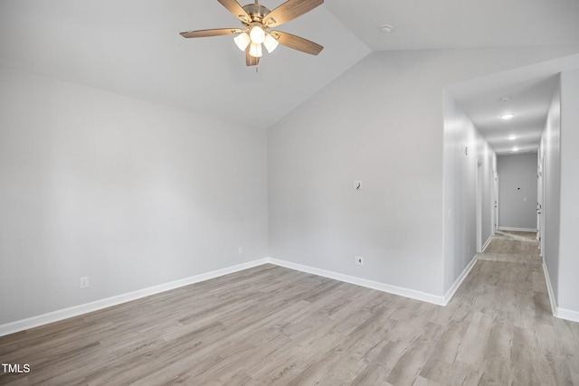 208 W Holt St, Burlington, NC 27217 - spare room with a ceiling fan, vaulted ceiling, light wood-style floors, and baseboards