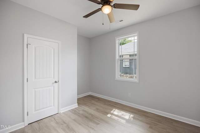 208 W Holt St, Burlington, NC 27217 - empty room featuring light wood-style floors, baseboards, and ceiling fan