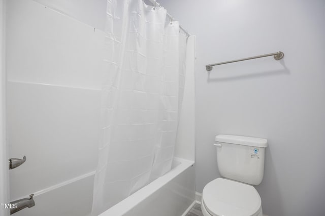 208 W Holt St, Burlington, NC 27217 - bathroom featuring toilet, shower / bath combination with curtain, and baseboards