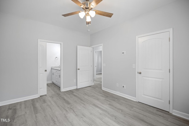 208 W Holt St, Burlington, NC 27217 - unfurnished bedroom with light wood-style flooring, baseboards, and ensuite bathroom