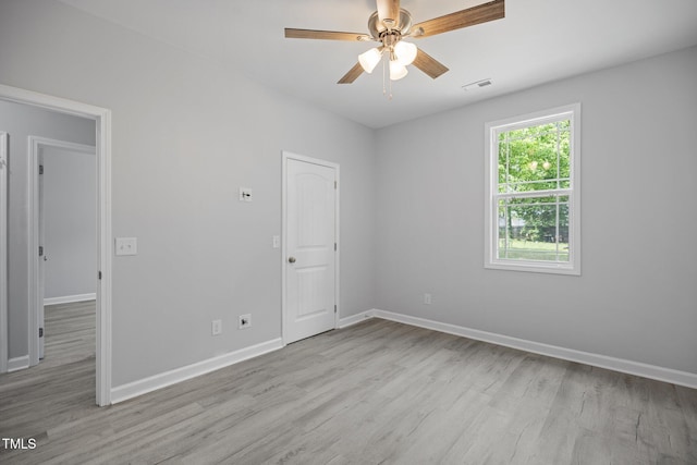 208 W Holt St, Burlington, NC 27217 - empty room featuring wood finished floors, baseboards, and ceiling fan