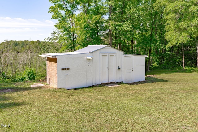 view of shed featuring a forest view