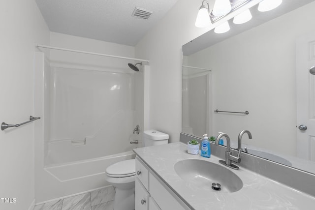 full bathroom featuring toilet, vanity, marble finish flooring, shower / bath combination, and a textured ceiling