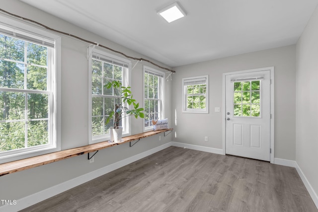 unfurnished sunroom with healthy amount of natural light
