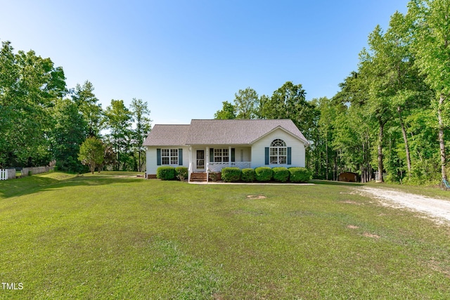 ranch-style house with covered porch and a front yard