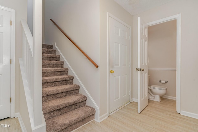 509 Darby Glen Ln, Durham, NC 27713 - stairway with wood finished floors and baseboards