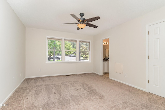 509 Darby Glen Ln, Durham, NC 27713 - spare room with light colored carpet, a ceiling fan, and baseboards
