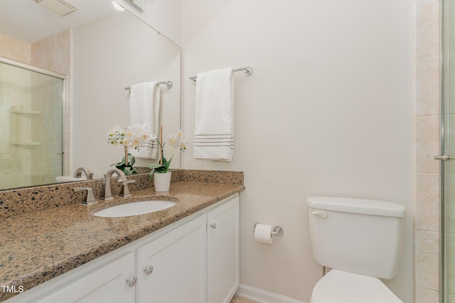509 Darby Glen Ln, Durham, NC 27713 - bathroom featuring vanity, toilet, a tile shower, and baseboards