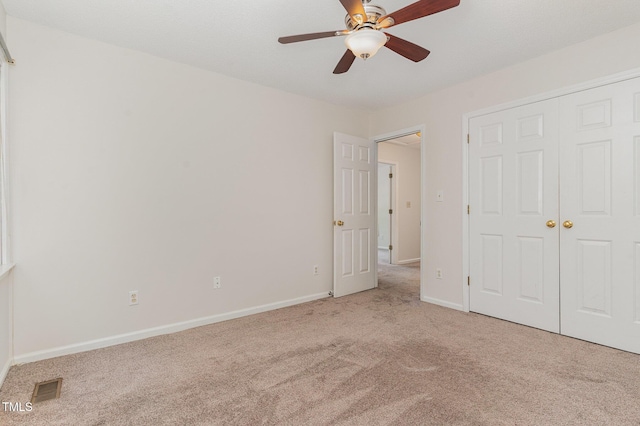 509 Darby Glen Ln, Durham, NC 27713 - unfurnished bedroom featuring carpet flooring, baseboards, and ceiling fan