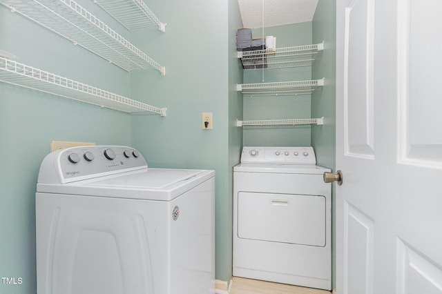 509 Darby Glen Ln, Durham, NC 27713 - laundry area featuring independent washer and dryer and wood finished floors