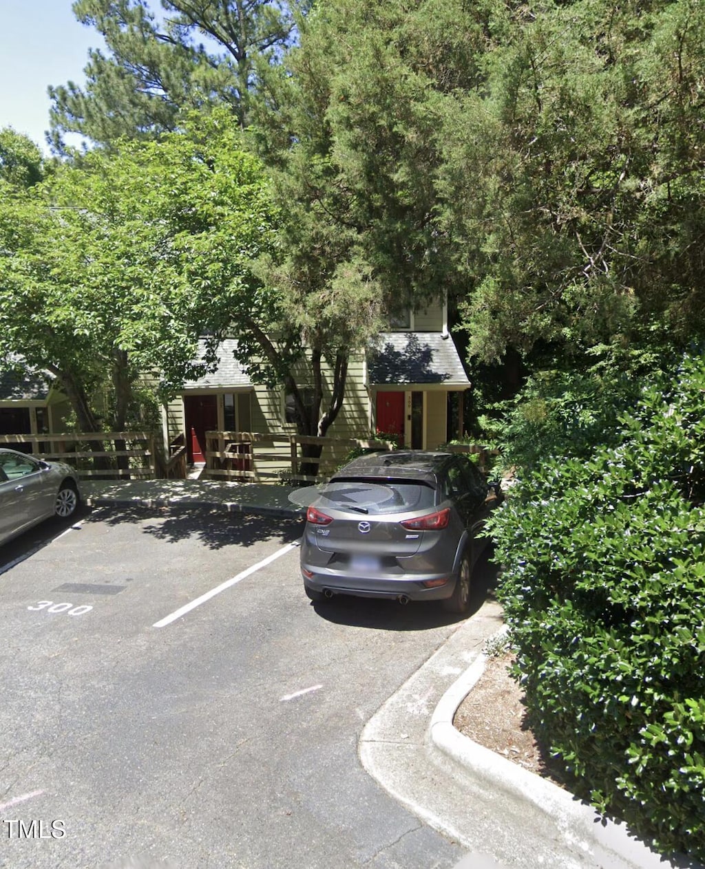 obstructed view of property featuring uncovered parking