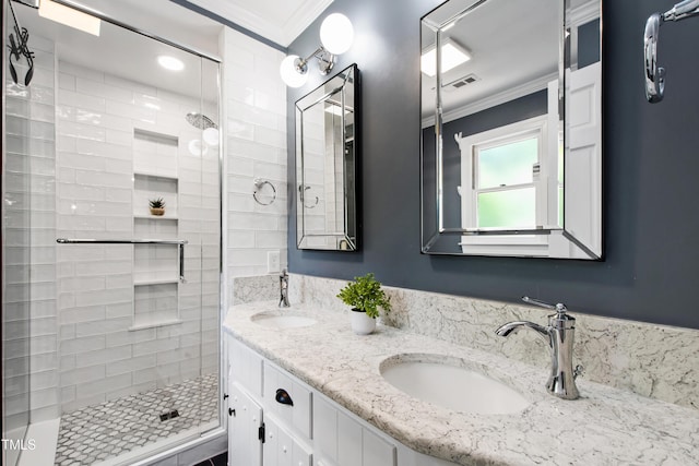 bathroom featuring ornamental molding, a stall shower, and double vanity