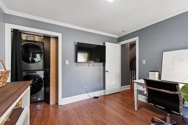 office area with stacked washing machine and dryer, wood finished floors, baseboards, and crown molding