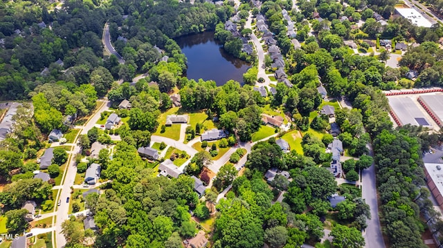aerial view of residential area featuring a large body of water