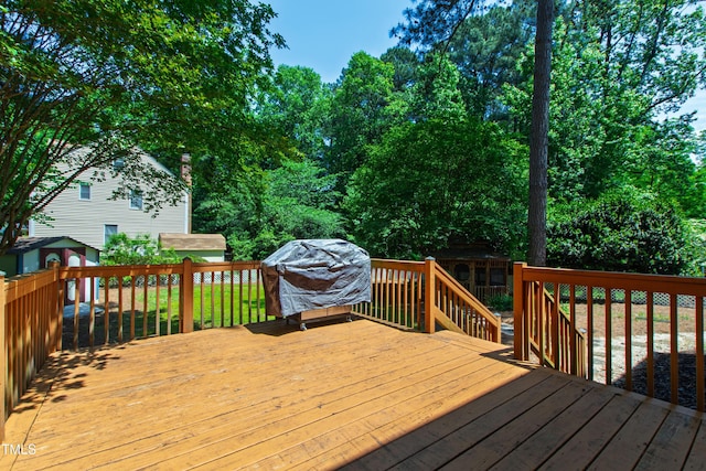 wooden terrace with area for grilling
