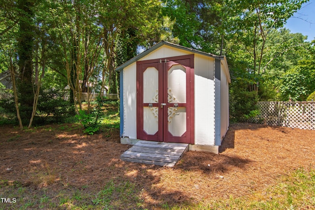 view of shed with a fenced backyard