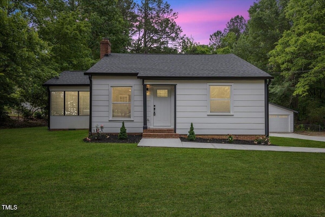 4713 Erwin Rd, Durham, NC 27705 - ranch-style house with a chimney, a front yard, roof with shingles, and an outbuilding