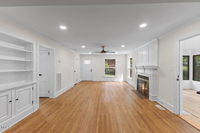 4713 Erwin Rd, Durham, NC 27705 - unfurnished living room with ornamental molding, a fireplace, light wood finished floors, ceiling fan, and recessed lighting