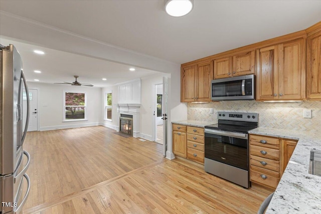 4713 Erwin Rd, Durham, NC 27705 - kitchen with stainless steel appliances, baseboards, light wood finished floors, tasteful backsplash, and recessed lighting