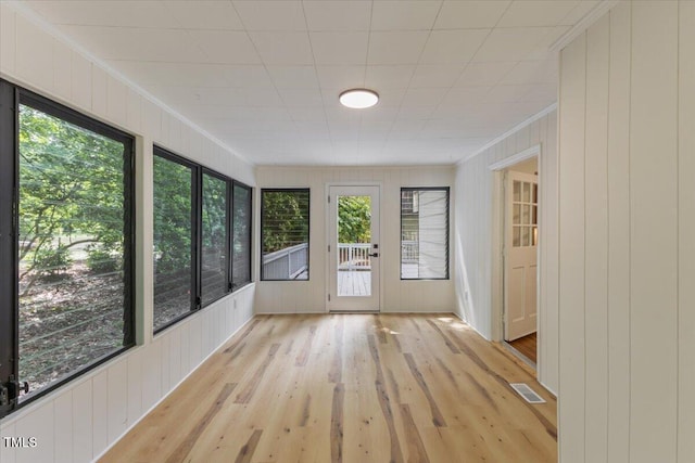 4713 Erwin Rd, Durham, NC 27705 - unfurnished sunroom with ornamental molding, plenty of natural light, wood finished floors, and wooden walls