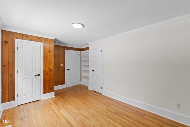 4713 Erwin Rd, Durham, NC 27705 - unfurnished bedroom with baseboards, light wood finished floors, ornamental molding, and a closet