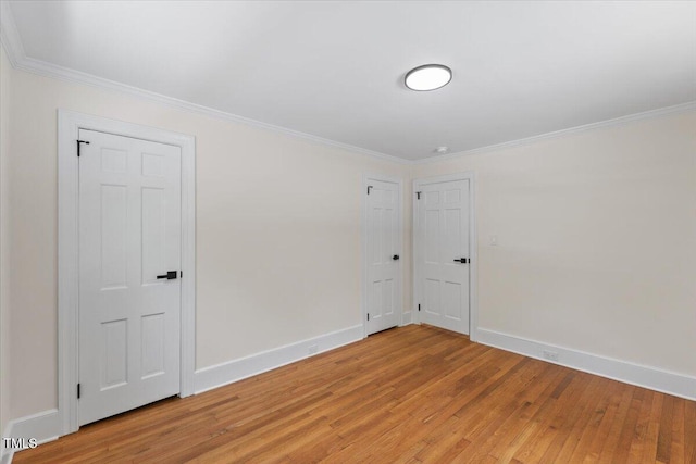 4713 Erwin Rd, Durham, NC 27705 - spare room featuring light wood-style flooring, ornamental molding, and baseboards