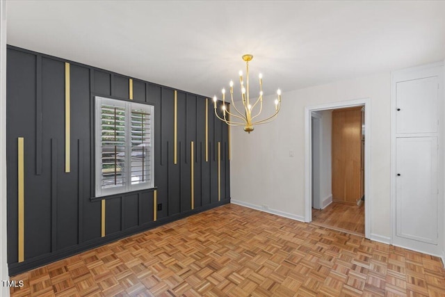 4713 Erwin Rd, Durham, NC 27705 - empty room with a chandelier, baseboards, and a decorative wall