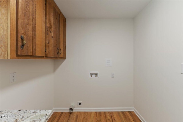 4713 Erwin Rd, Durham, NC 27705 - washroom with cabinet space, hookup for a washing machine, wood finished floors, and baseboards