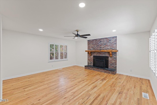 4713 Erwin Rd, Durham, NC 27705 - unfurnished living room featuring wood finished floors, a ceiling fan, baseboards, recessed lighting, and a brick fireplace
