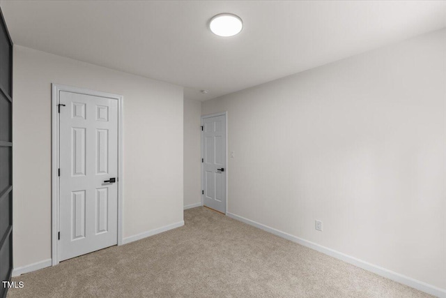 4713 Erwin Rd, Durham, NC 27705 - unfurnished bedroom with carpet floors and baseboards