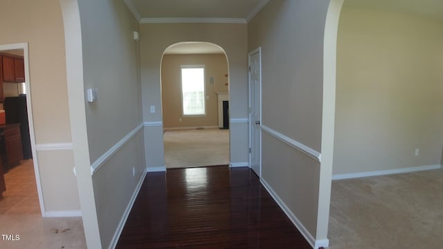 919 Middle Ground Ave, Rolesville, NC 27571 - hallway featuring arched walkways, crown molding, baseboards, light carpet, and light wood finished floors