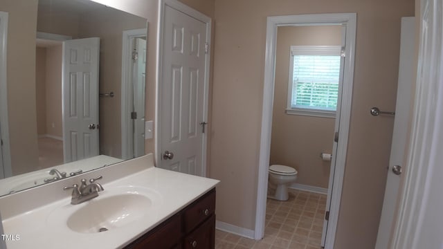 919 Middle Ground Ave, Rolesville, NC 27571 - bathroom featuring toilet, vanity, and baseboards