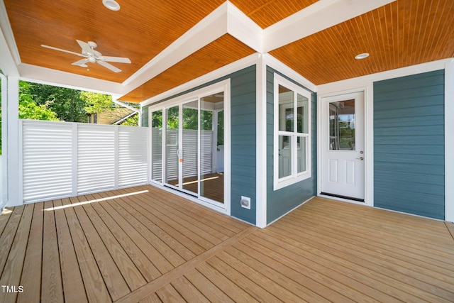 wooden deck with a ceiling fan