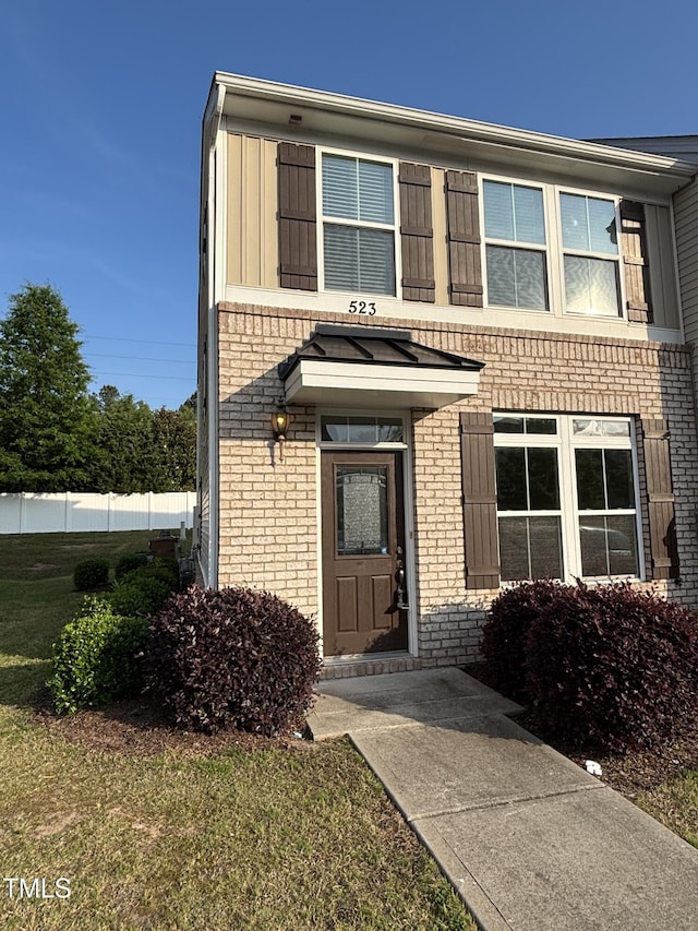 view of front of house featuring brick siding