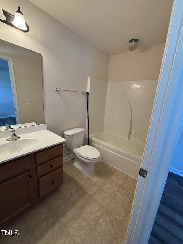 full bathroom featuring toilet, vanity,  shower combination, and tile patterned flooring