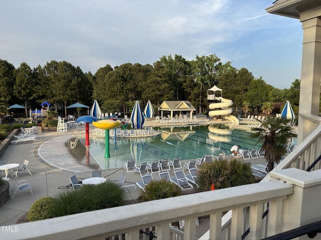 view of pool featuring a water play area