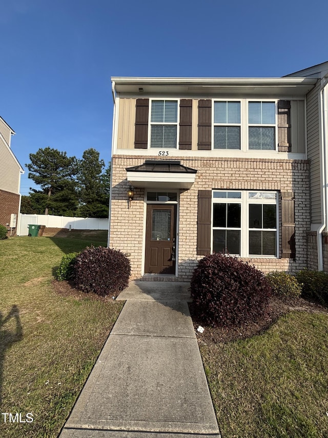 traditional home featuring brick siding