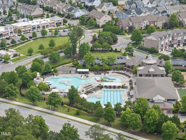 aerial view of residential area featuring a pool