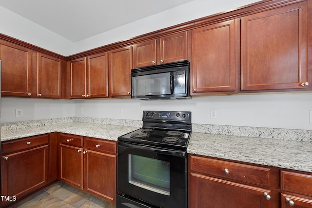 kitchen with black appliances and light stone counters
