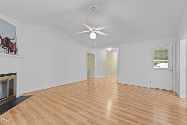 4705 Forest Highland Dr, Raleigh, NC 27604 - unfurnished living room featuring a glass covered fireplace, vaulted ceiling, a ceiling fan, light wood-type flooring, and baseboards