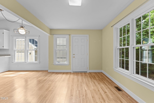 4705 Forest Highland Dr, Raleigh, NC 27604 - foyer featuring baseboards, healthy amount of natural light, and light wood finished floors
