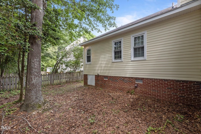 4705 Forest Highland Dr, Raleigh, NC 27604 - view of side of home featuring fence and crawl space